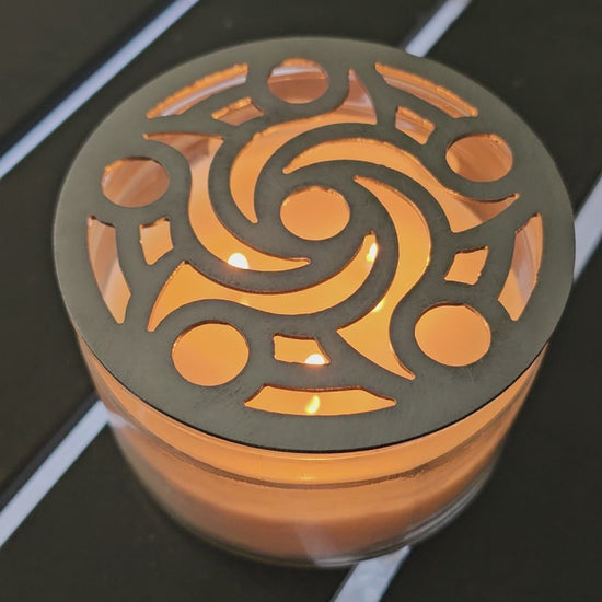 Reusable metal candle topper on jar candle